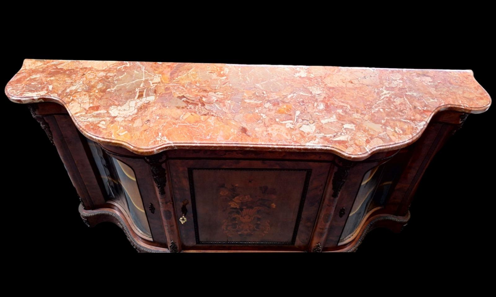 A Louis XV  style marble topped sideboard.