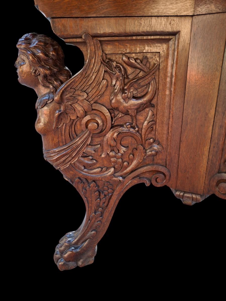 A tripod oak center table.