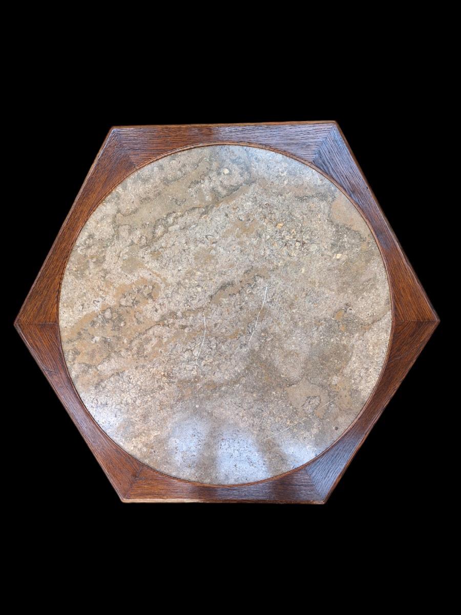 A tripod oak center table.