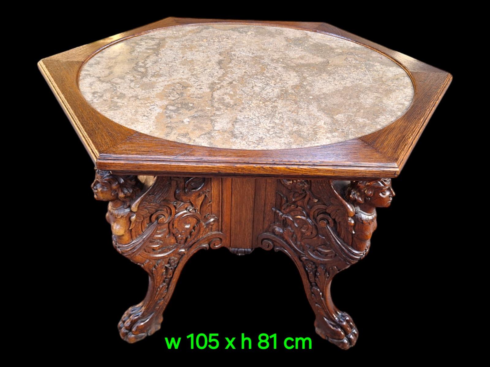 A tripod oak center table.