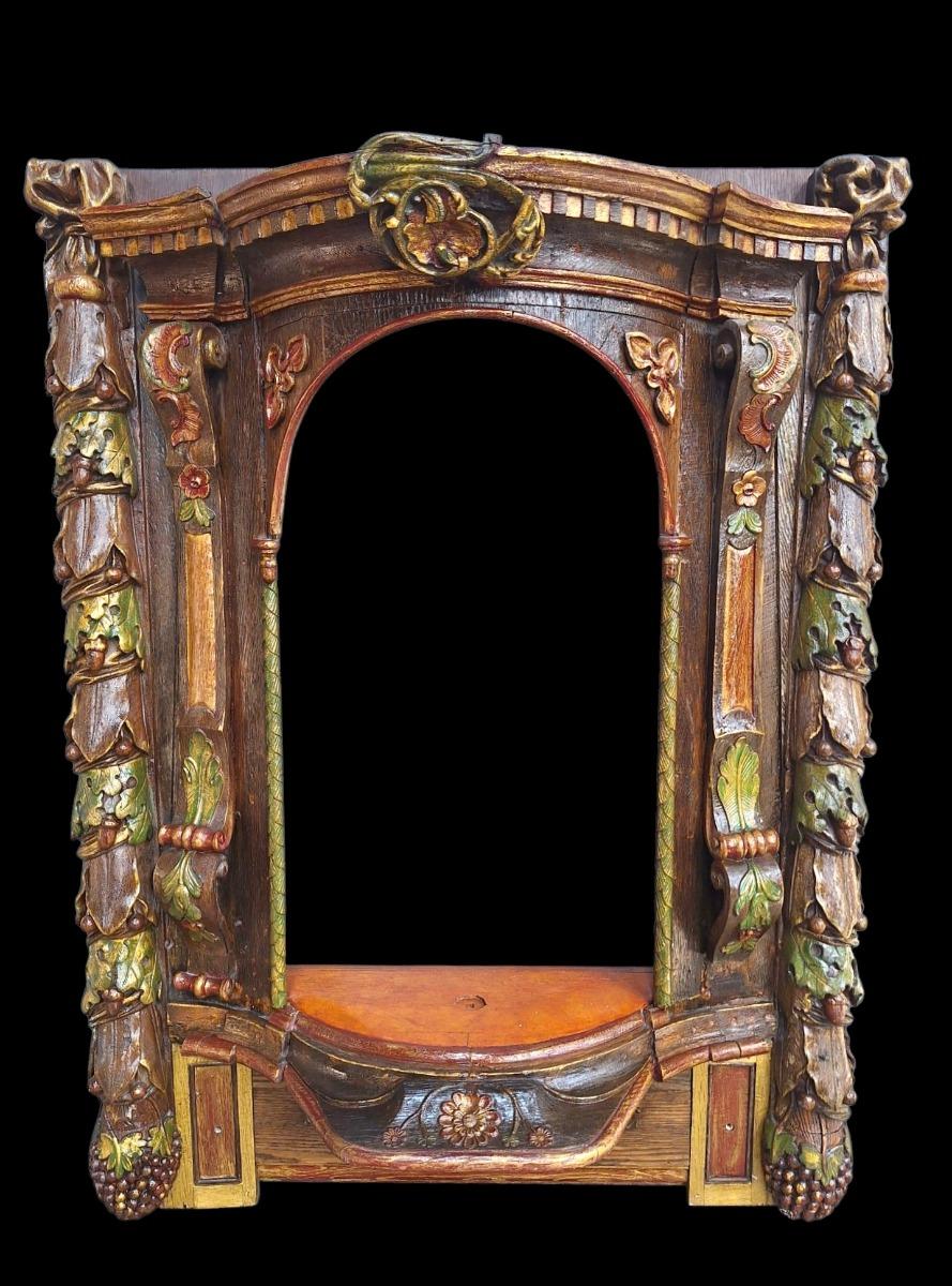 Carved wooden and polychromed niche.