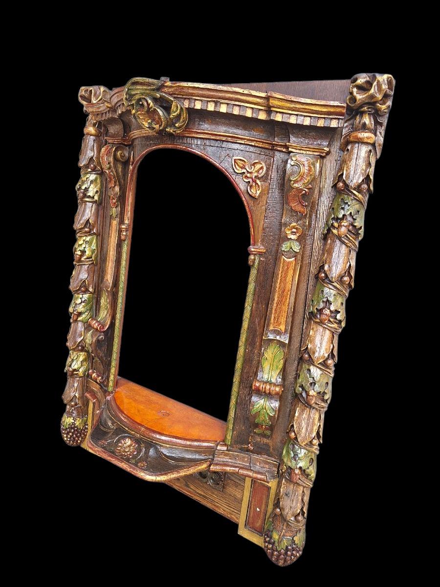 Carved wooden and polychromed niche.