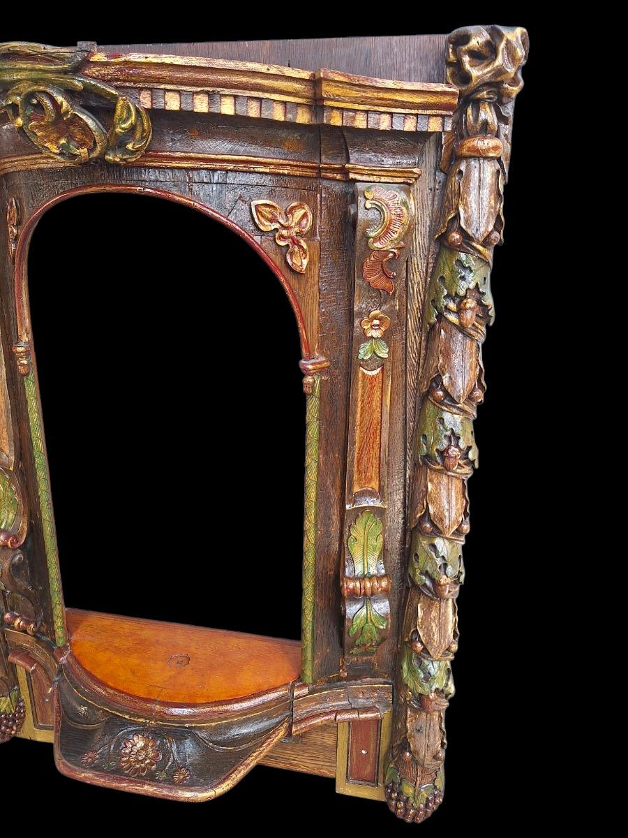 Carved wooden and polychromed niche.
