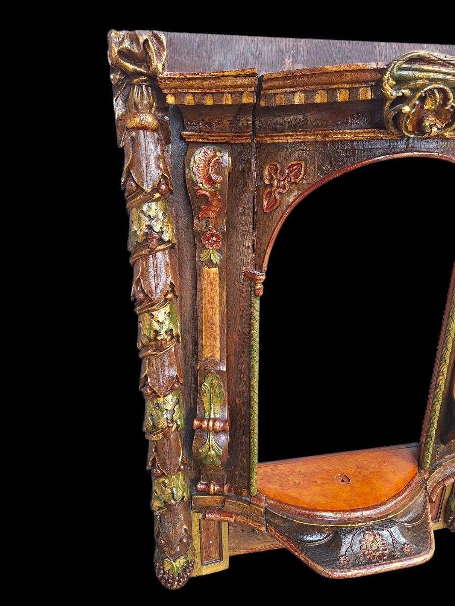 Carved wooden and polychromed niche.