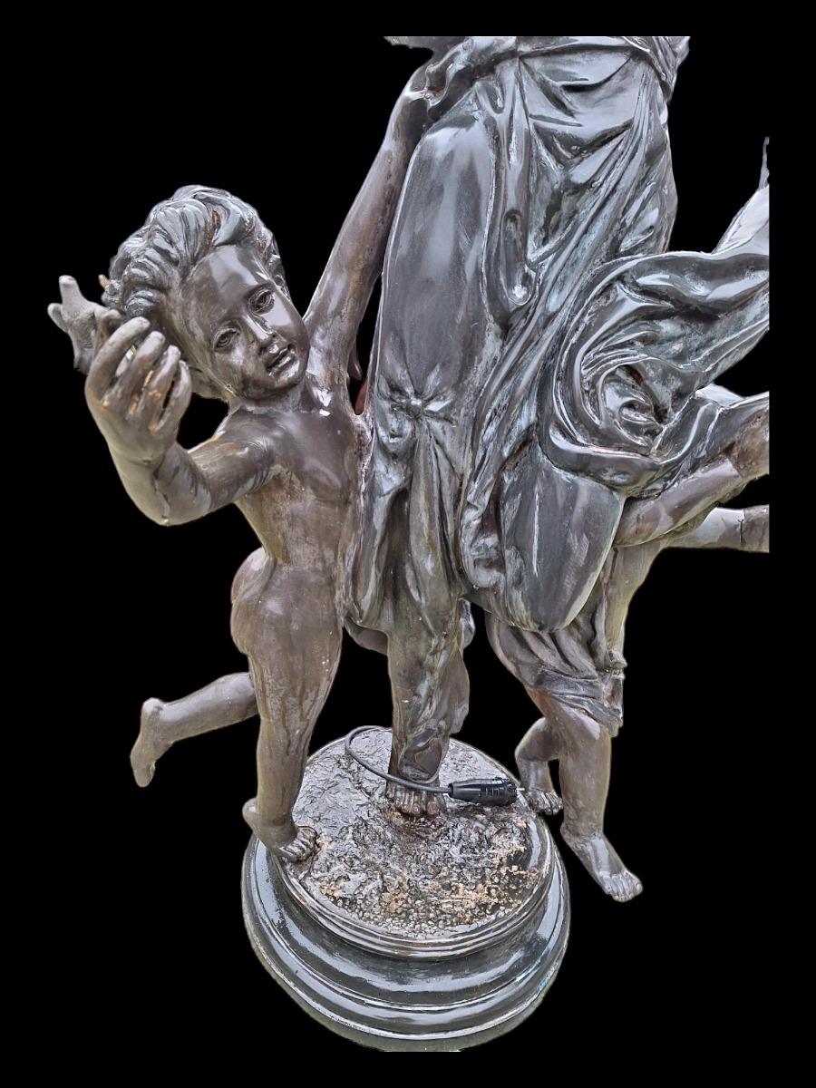 Decorative bronze lamp with romantic figures.