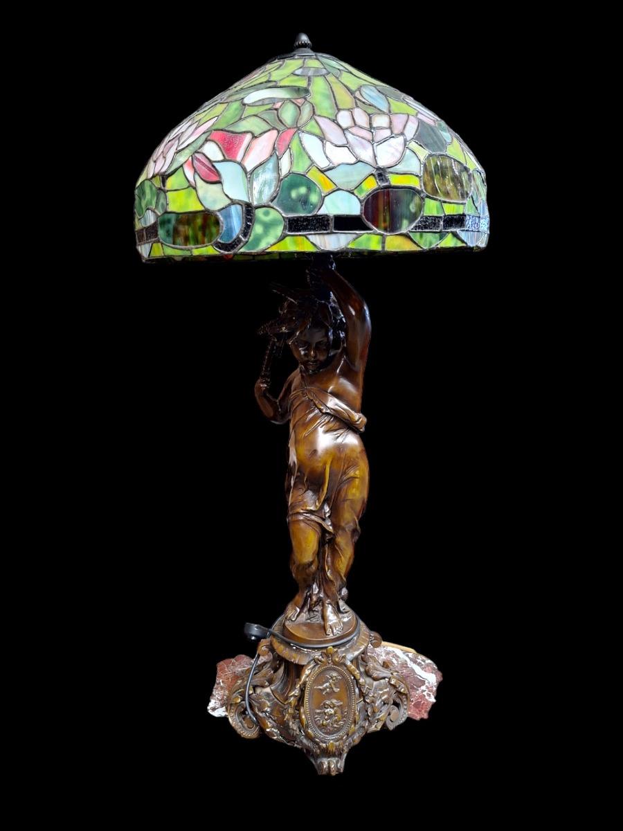Lamp with tiffany-style shade.
