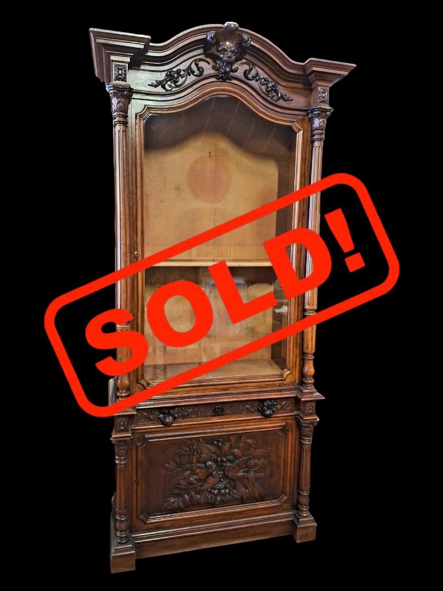 Monumental walnut display cabinet.