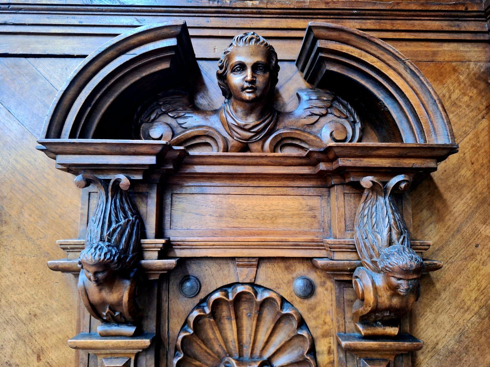 Richely carved walnut wardrobe